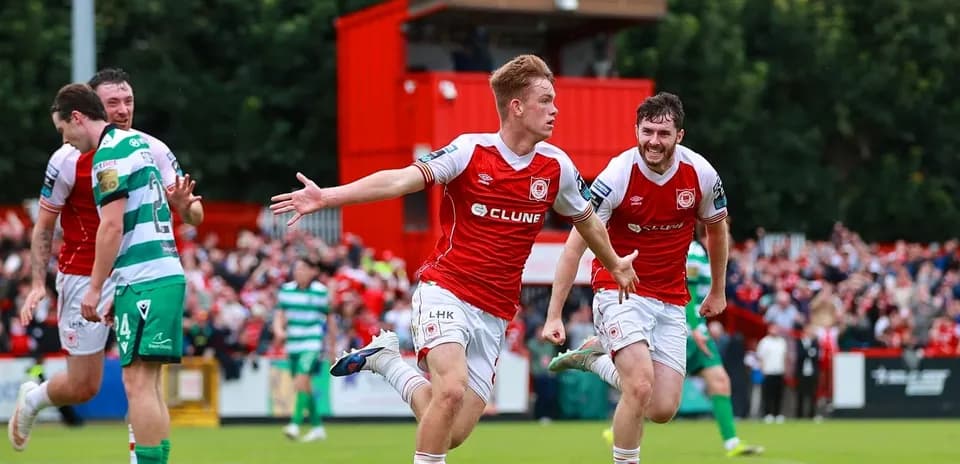 Player celebrating a goal with teammates during match