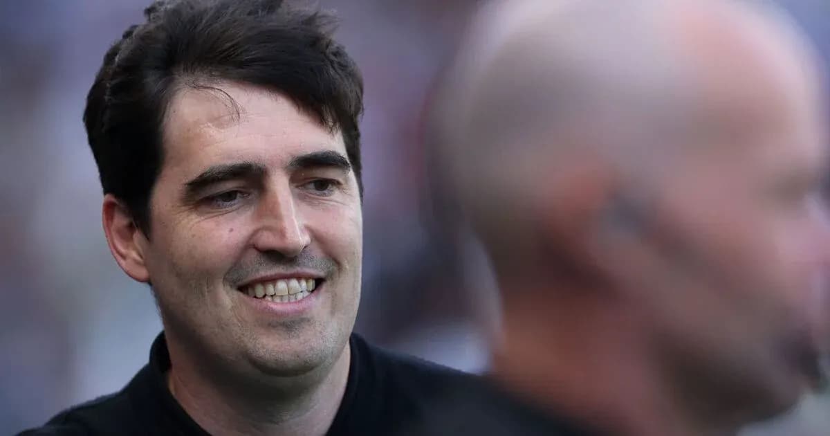 Coach smiling during match day preparations