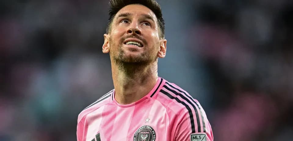 Player in pink jersey looking upwards during match