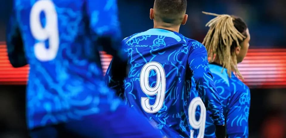 Players wearing blue jerseys with number 9