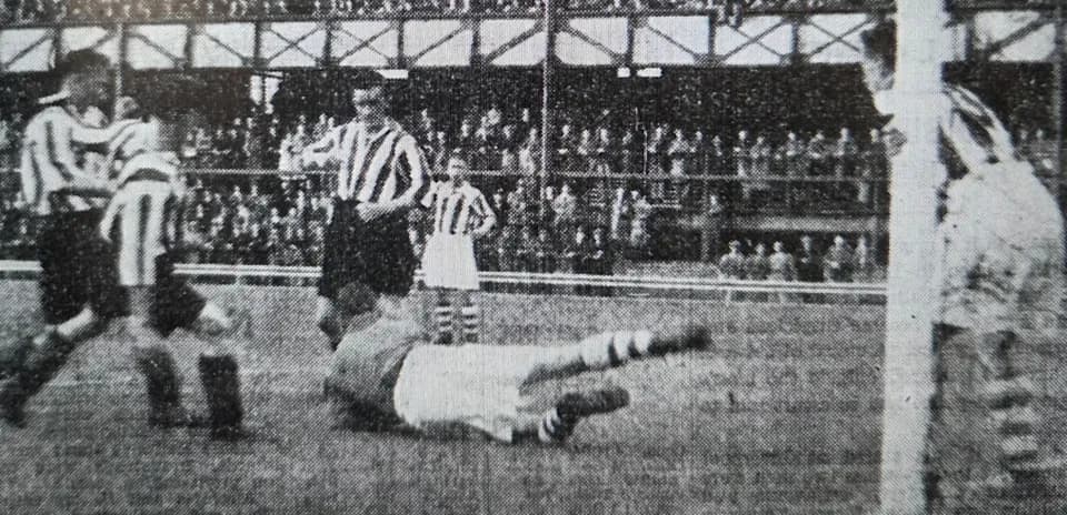 Players in striped jerseys during a historic football match