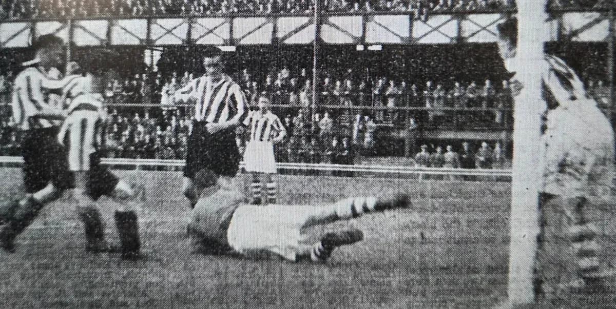 Players in striped jerseys during a historic football match