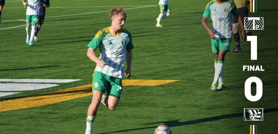 Player dribbling during The Town vs Portland Timbers II