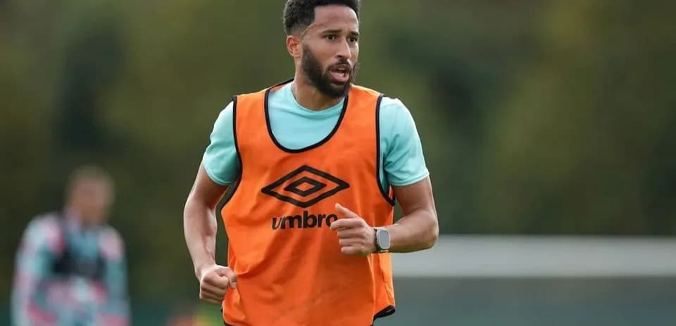 Player running during training session in orange vest