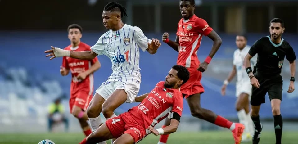 Al Ain U23 player evading tackle during match