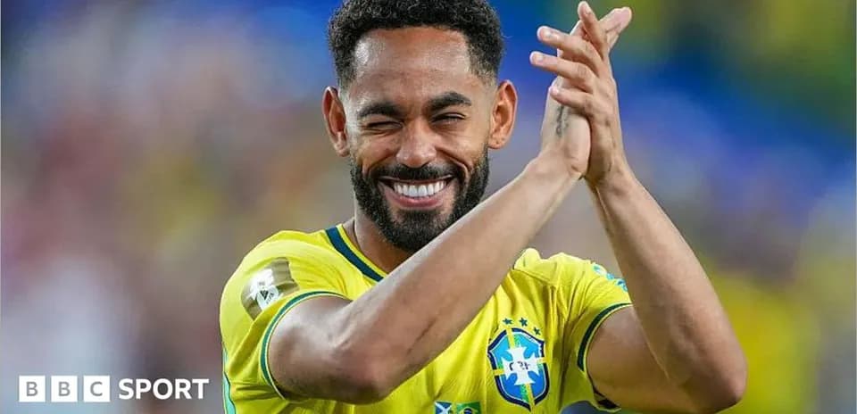 Player celebrating and applauding in Brazil jersey