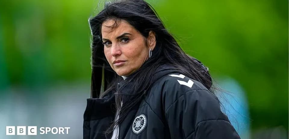 Coach observing players during training session