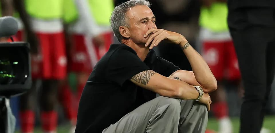 Coach sitting on the sideline during a match