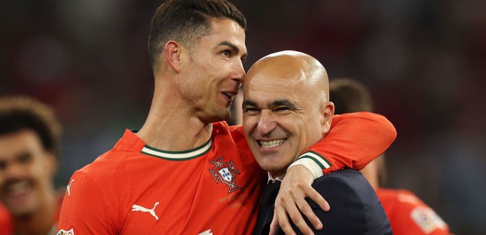 Cristiano Ronaldo celebrating with coach Roberto Martinez