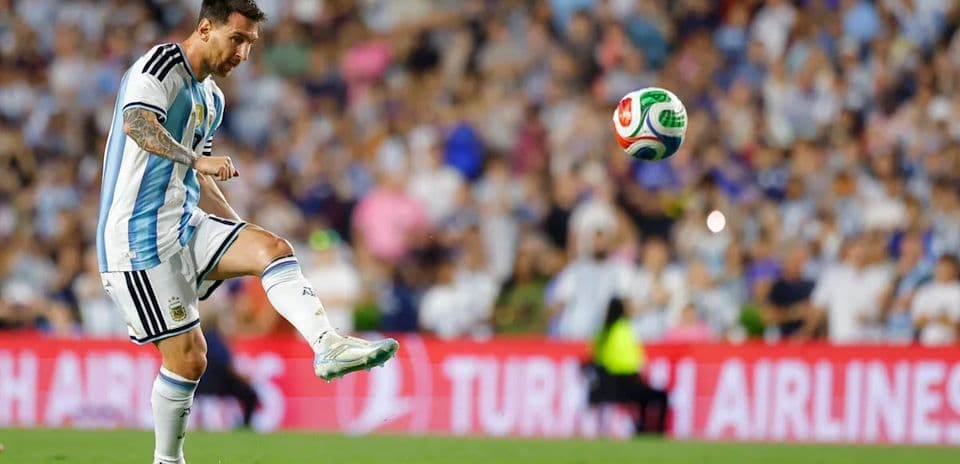 Player kicking a soccer ball during match
