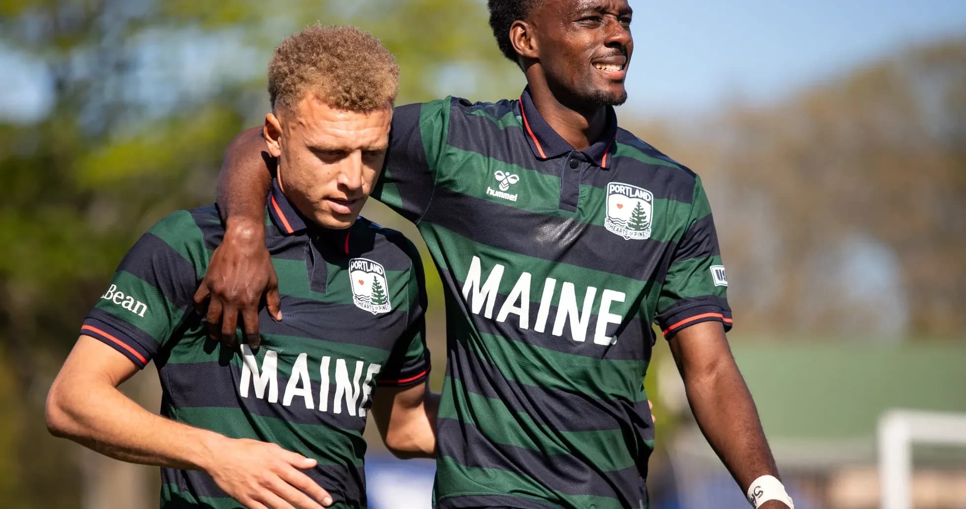 Two Portland Hearts of Pine players celebrating