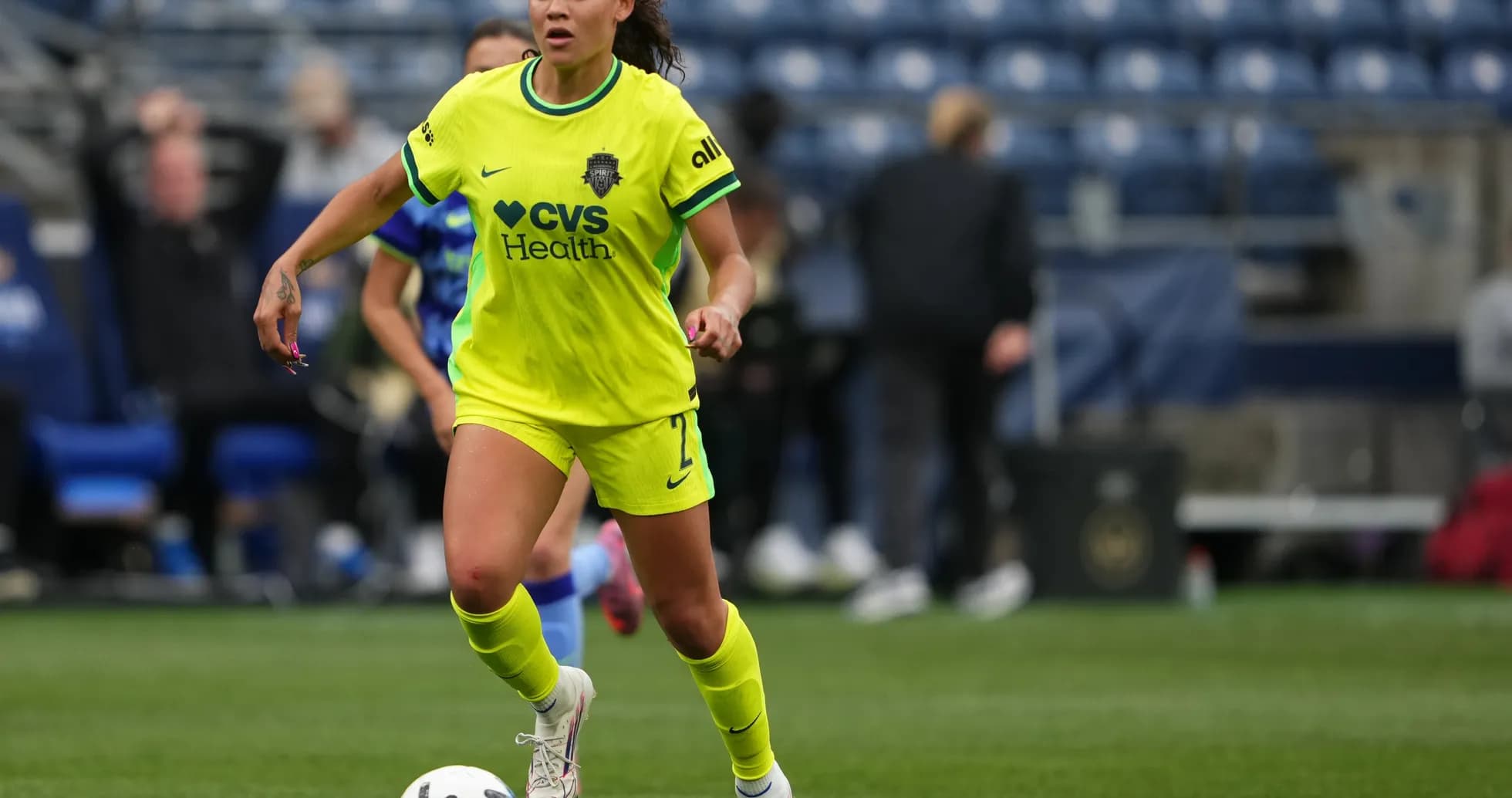 Player in yellow jersey dribbling the ball