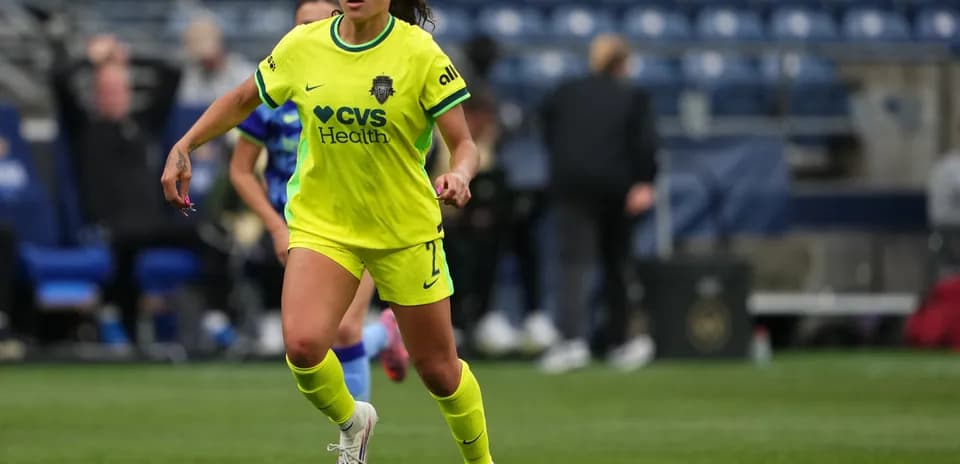 Player in yellow jersey dribbling the ball