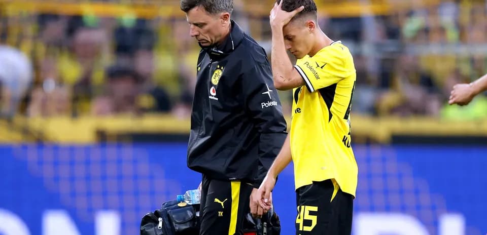 Player receiving medical attention on the field