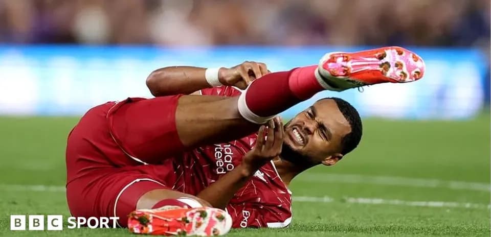 Player lying on the ground with injured leg
