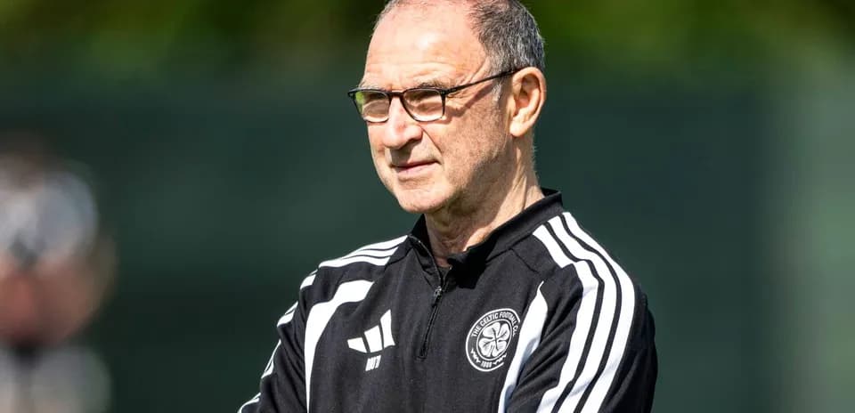 Manager observing players during training session