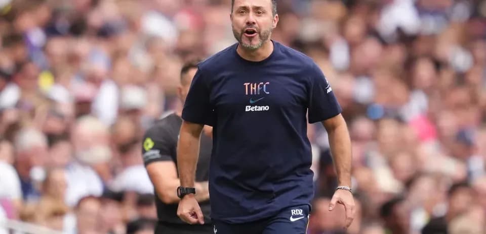 Coach directing players during match on sidelines
