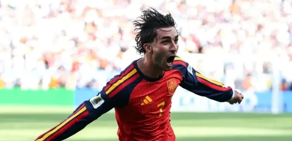Player celebrating after scoring for Spain