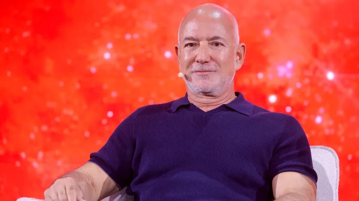Person speaking at an event with red background