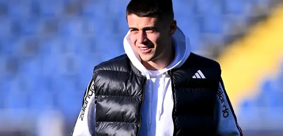 Player wearing a puffy vest at stadium