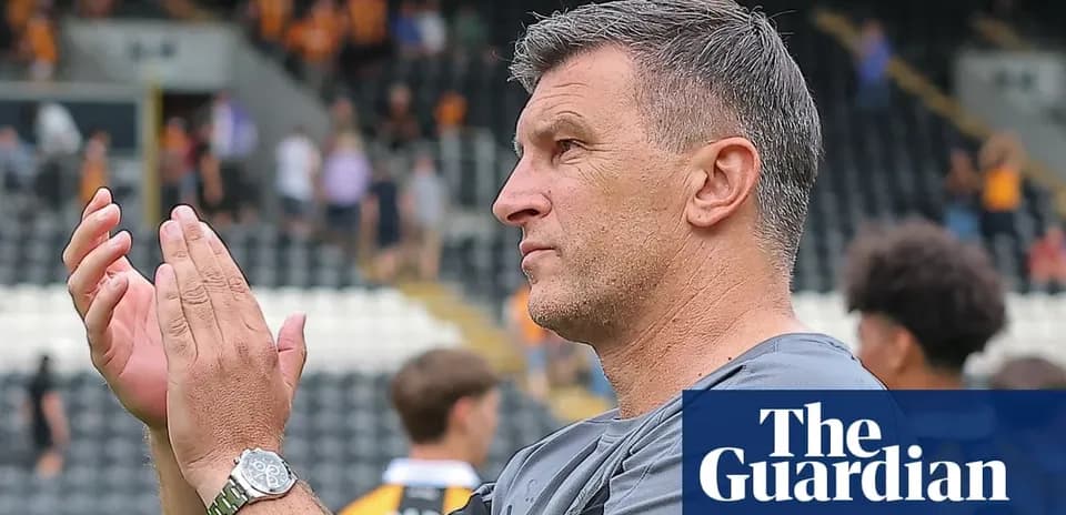 Coach applauding during a match at stadium