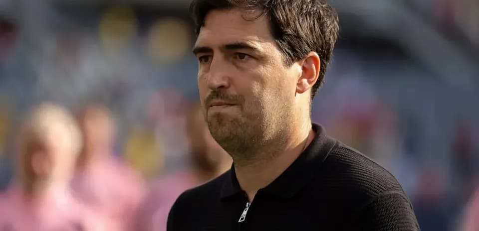 Coach observing from the sidelines during match