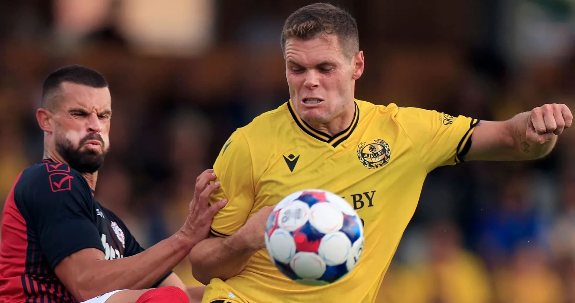 Mjallby player challenging for the ball