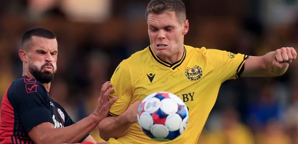 Mjallby player challenging for the ball