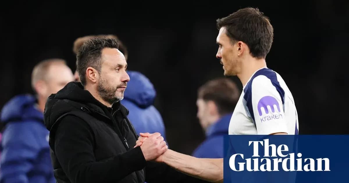 Two coaches shaking hands after a match