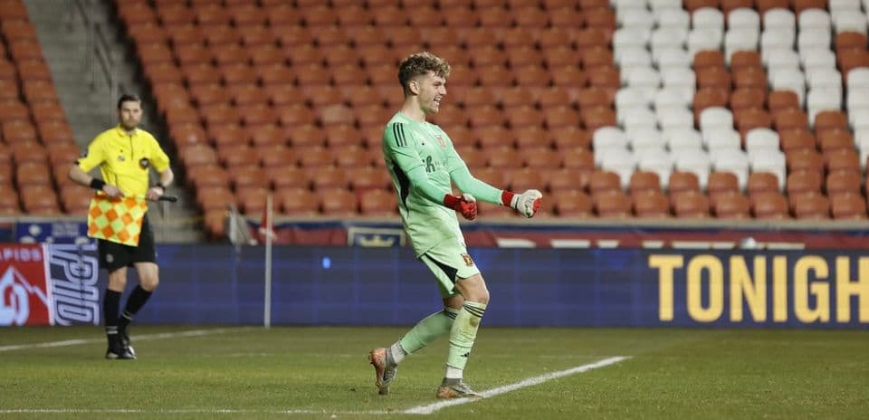 Goalkeeper celebrating during match at stadium