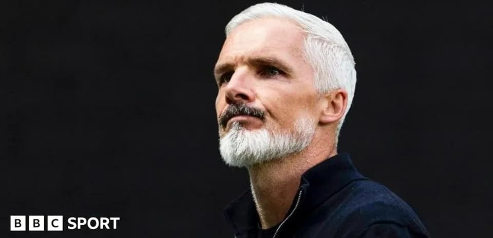 Coach with gray hair and beard looking thoughtfully