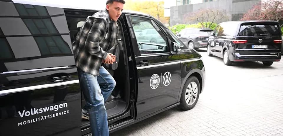 Player exiting Volkswagen vehicle at event location