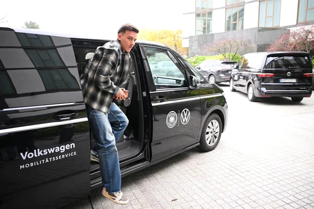 Player exiting Volkswagen vehicle at event location
