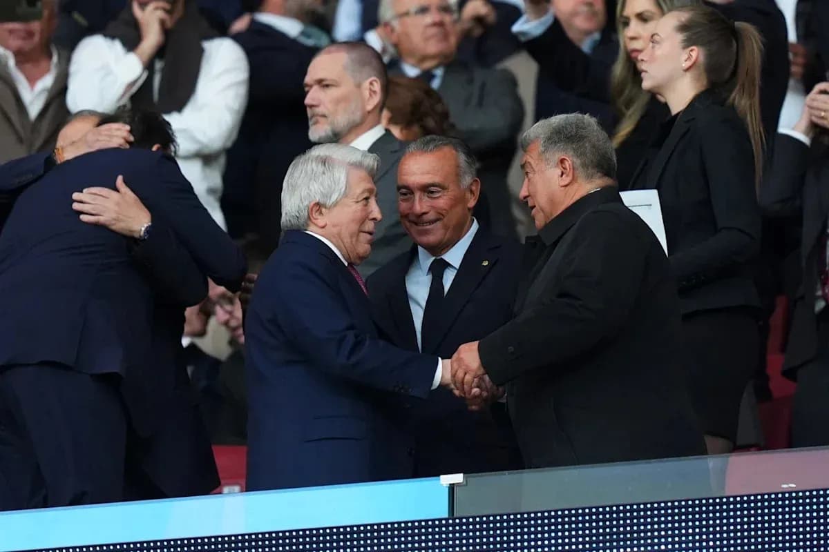 Three individuals shaking hands in stadium seats