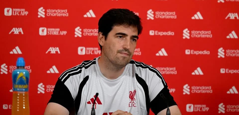 Manager at Liverpool FC press conference table