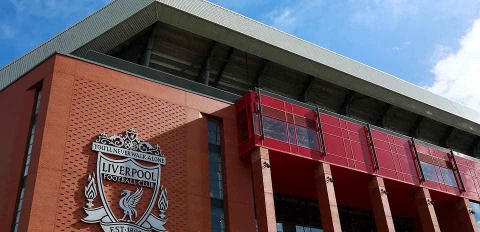 Exterior of Anfield stadium with Liverpool FC logo