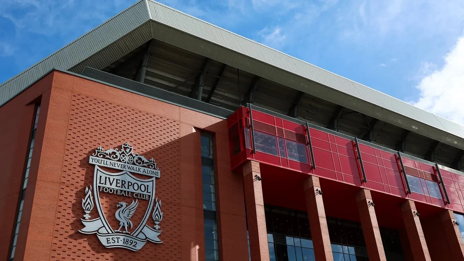 Exterior of Anfield stadium with Liverpool FC logo