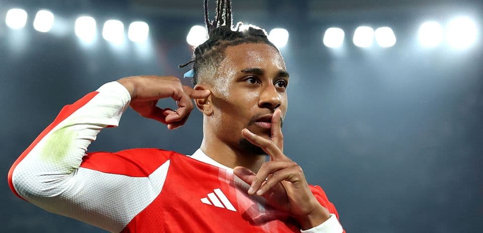 Player celebrating a goal with a shushing gesture