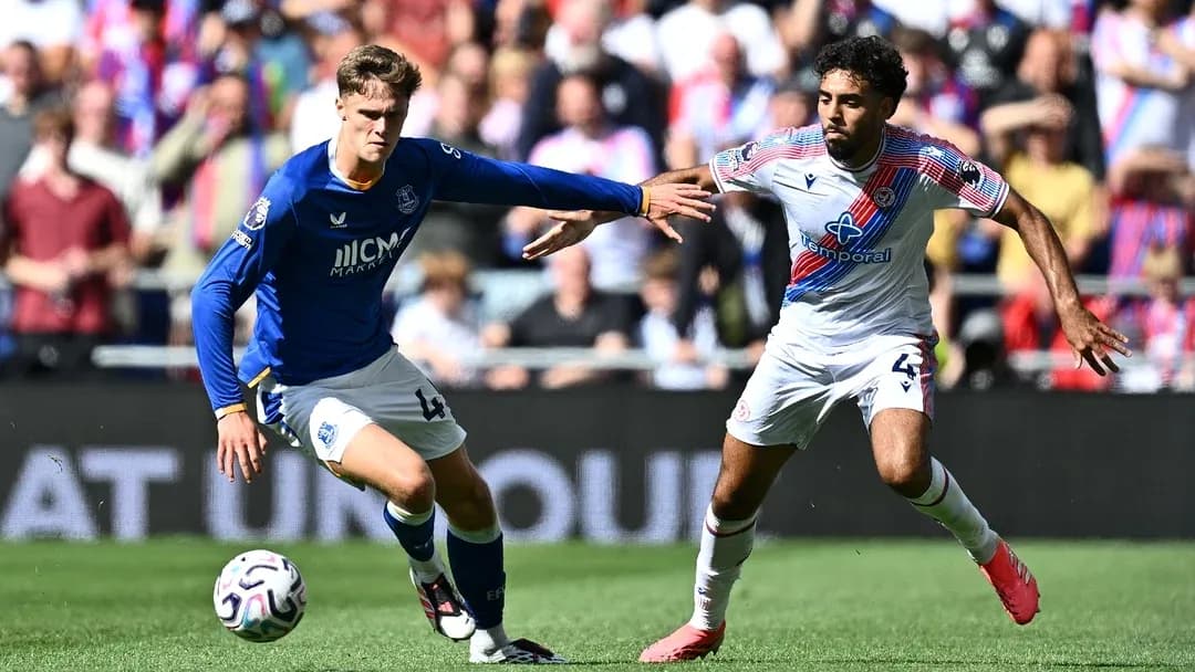 Two players contesting for the ball on the field