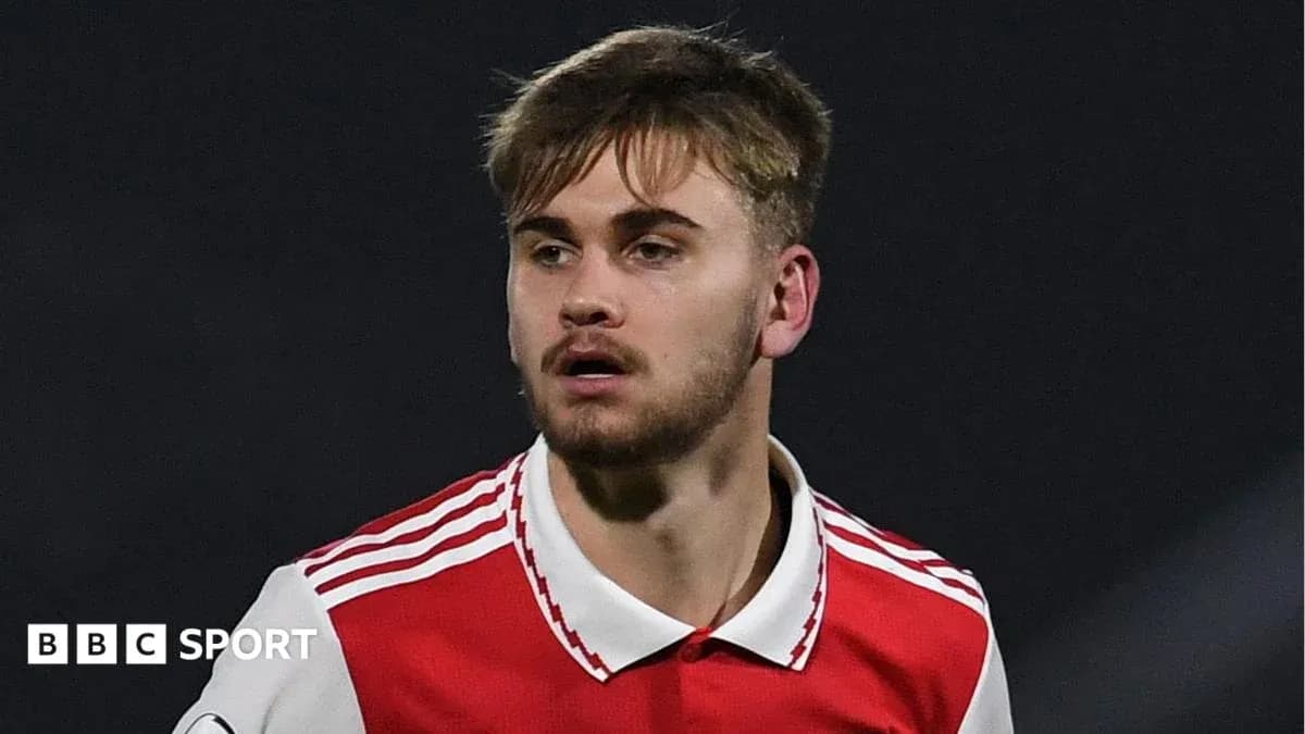 Player in Arsenal kit during match action