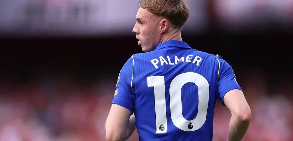 Player in blue jersey with the name Palmer and number 10