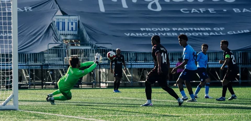 Goalkeeper saves shot during HFX Wanderers match