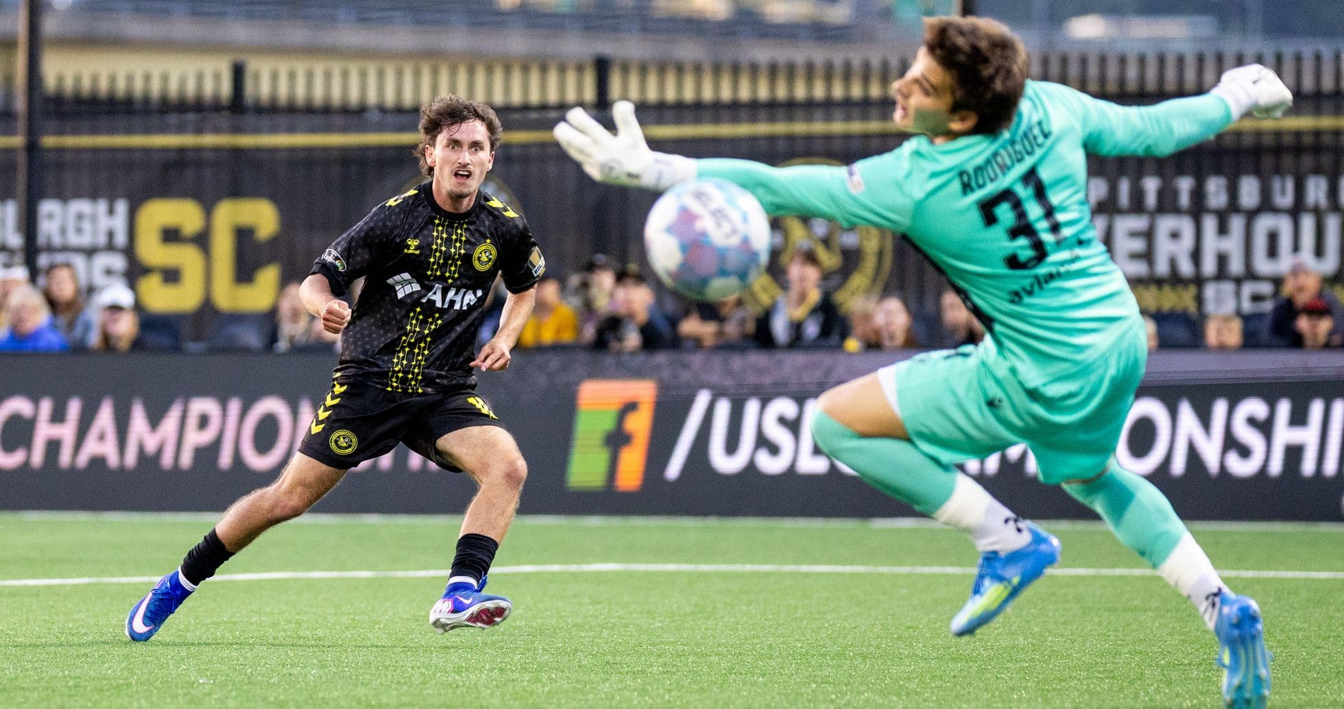 Player attempting to score against the goalkeeper