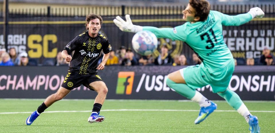 Player attempting to score against the goalkeeper