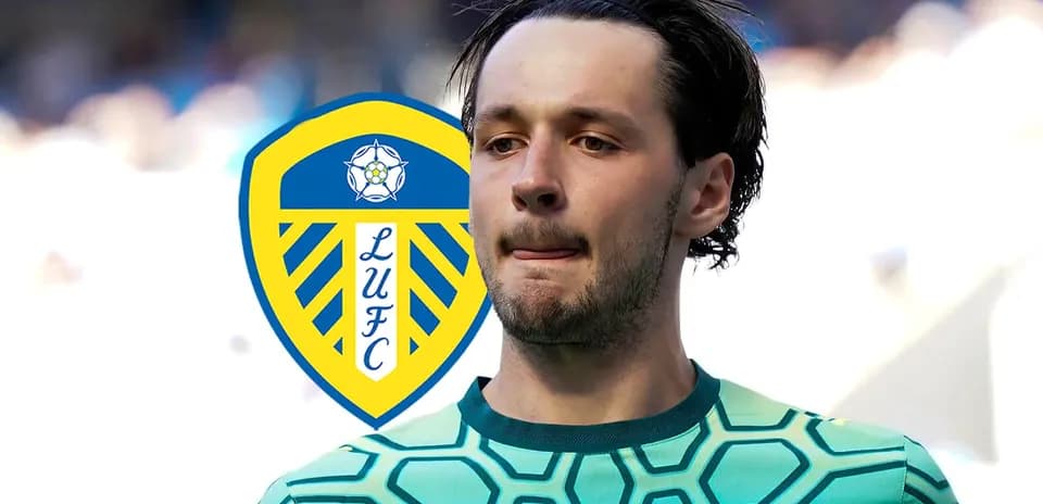 Goalkeeper in LUFC kit with club logo background