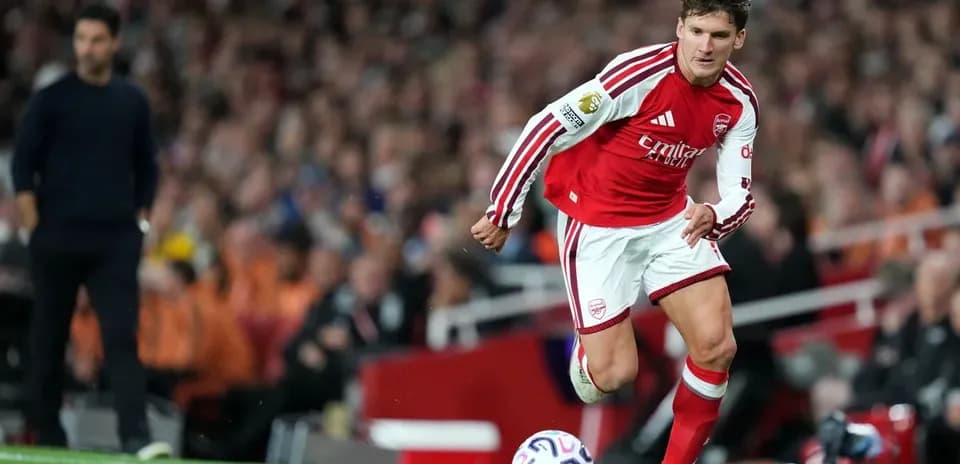 Player in red kit preparing to kick the ball