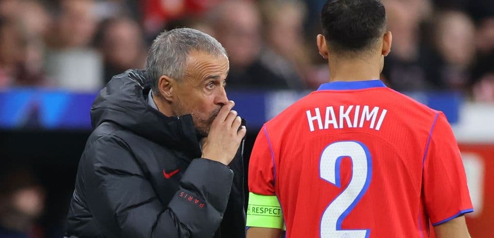 Coach giving instructions to player Hakimi on pitch