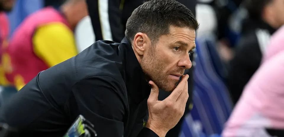Coach contemplating during match on sidelines