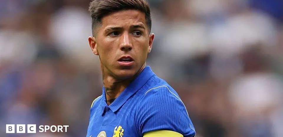 Player wearing blue jersey with captain's armband