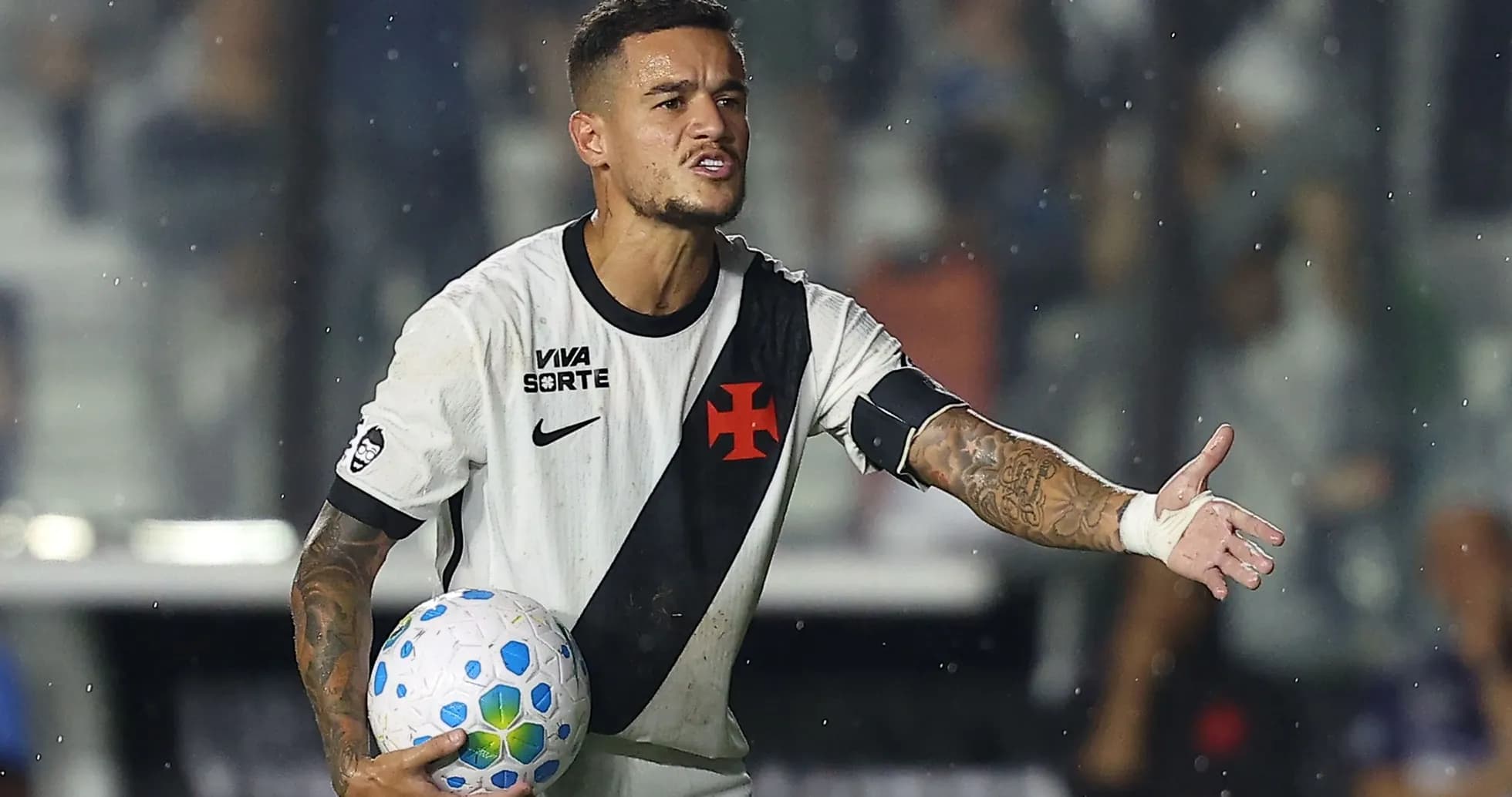 Player gesturing while holding a soccer ball
